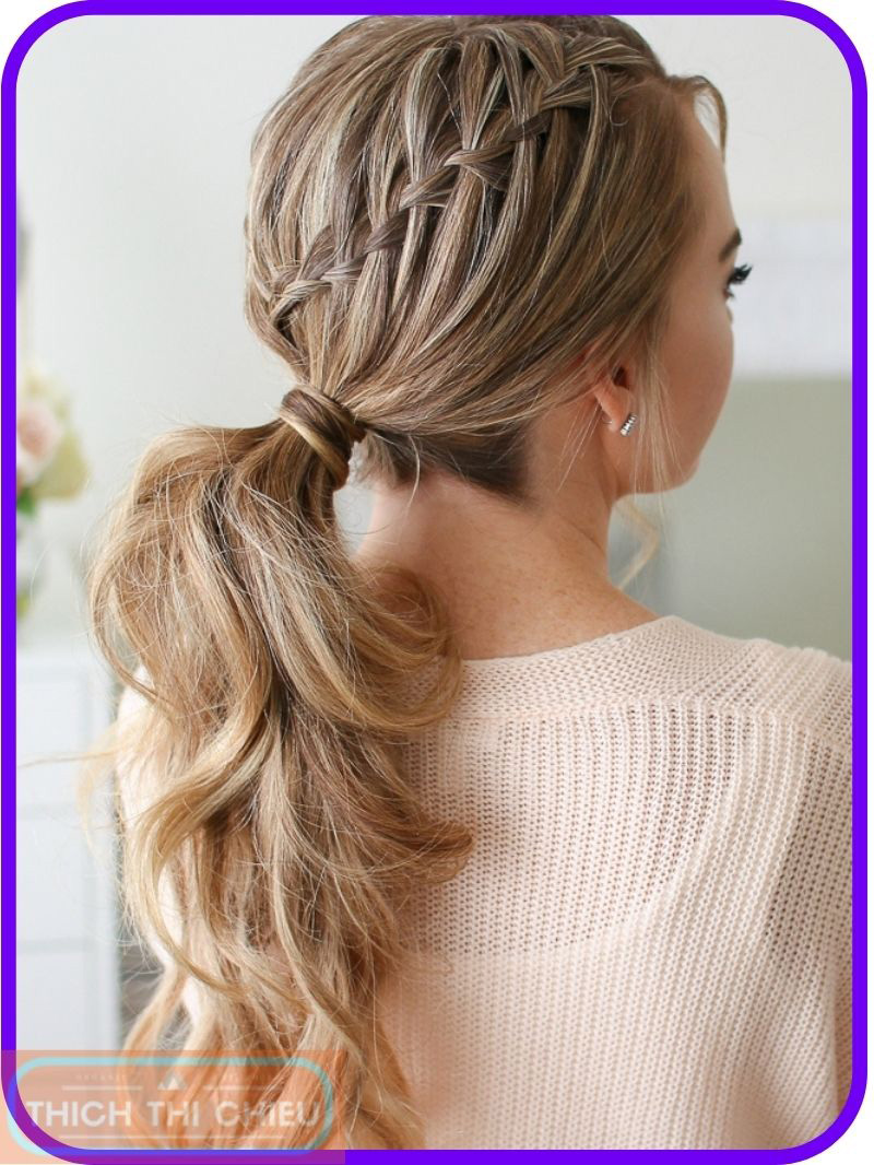 Side ponytail with a waterfall braid